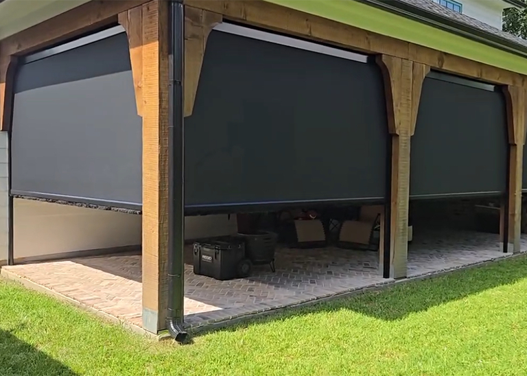 Motorized patio screen on a Houston outdoor living space
